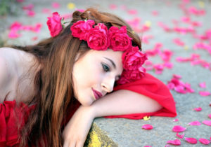 deep sad girl in love with rose petals