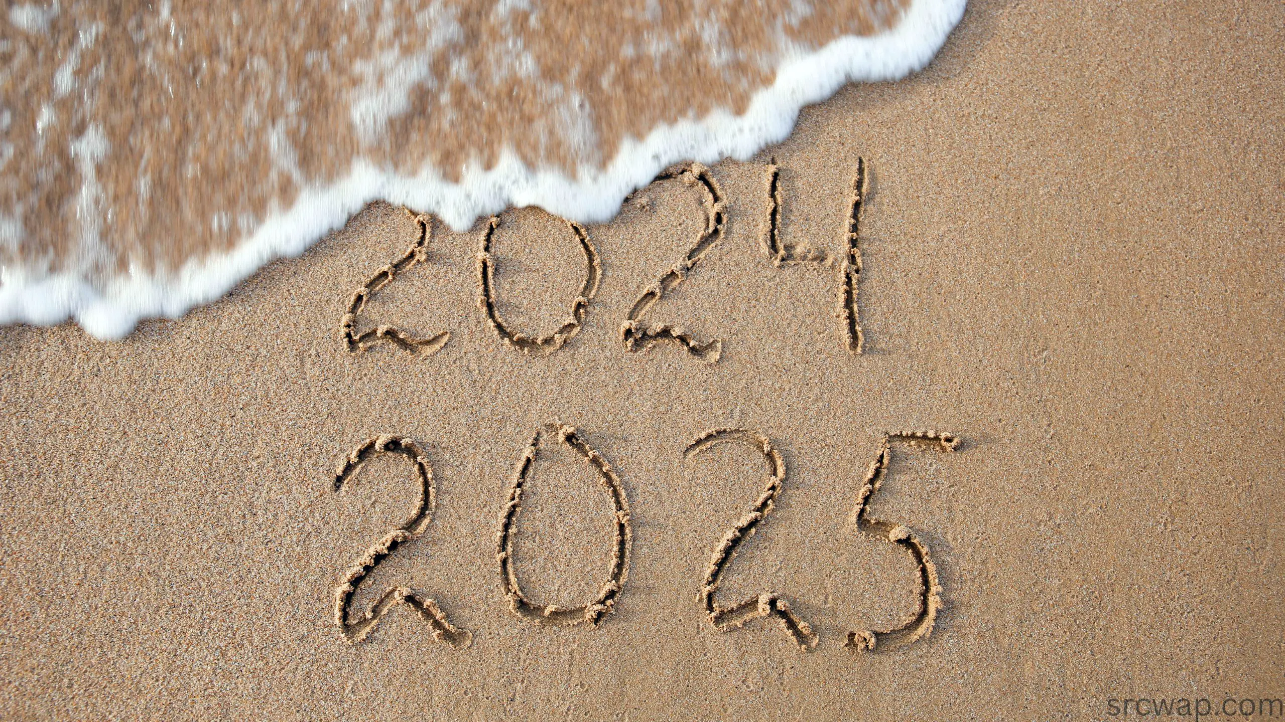 2024, 2025 years written on sandy beach sea. wave washes away 20