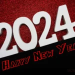 Happy new year 2024 with space copy on red and black glitter background